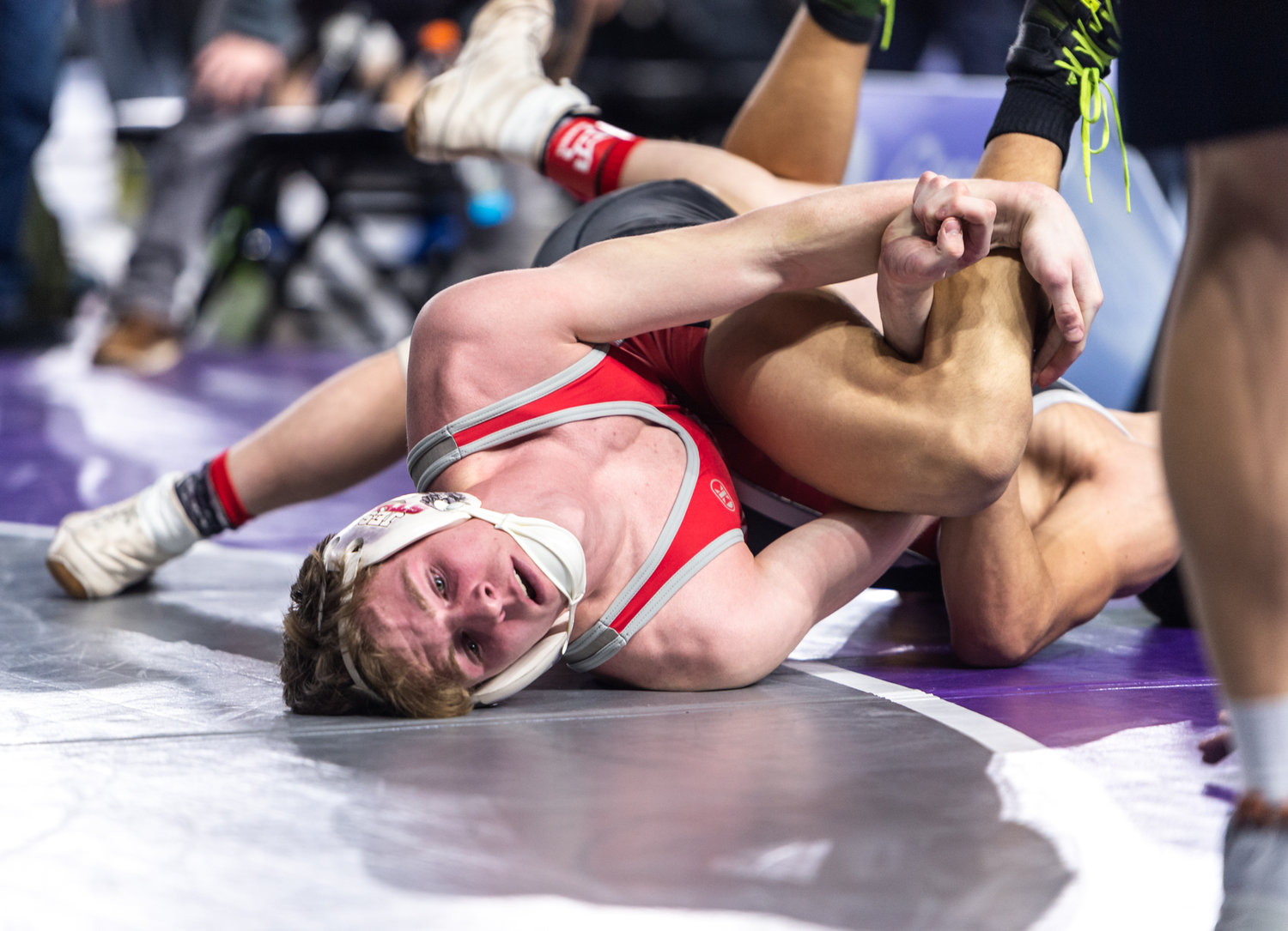 Davenport’s Brody Schillinger tries to withstand a pin against Toledo’s Bomani Birdwell, 152 pounds, in a first-round match at Mat Classic XXXIV on Friday, February 17, 2023, at the Tacoma Dome. (Joshua Hart/For The Chronicle)